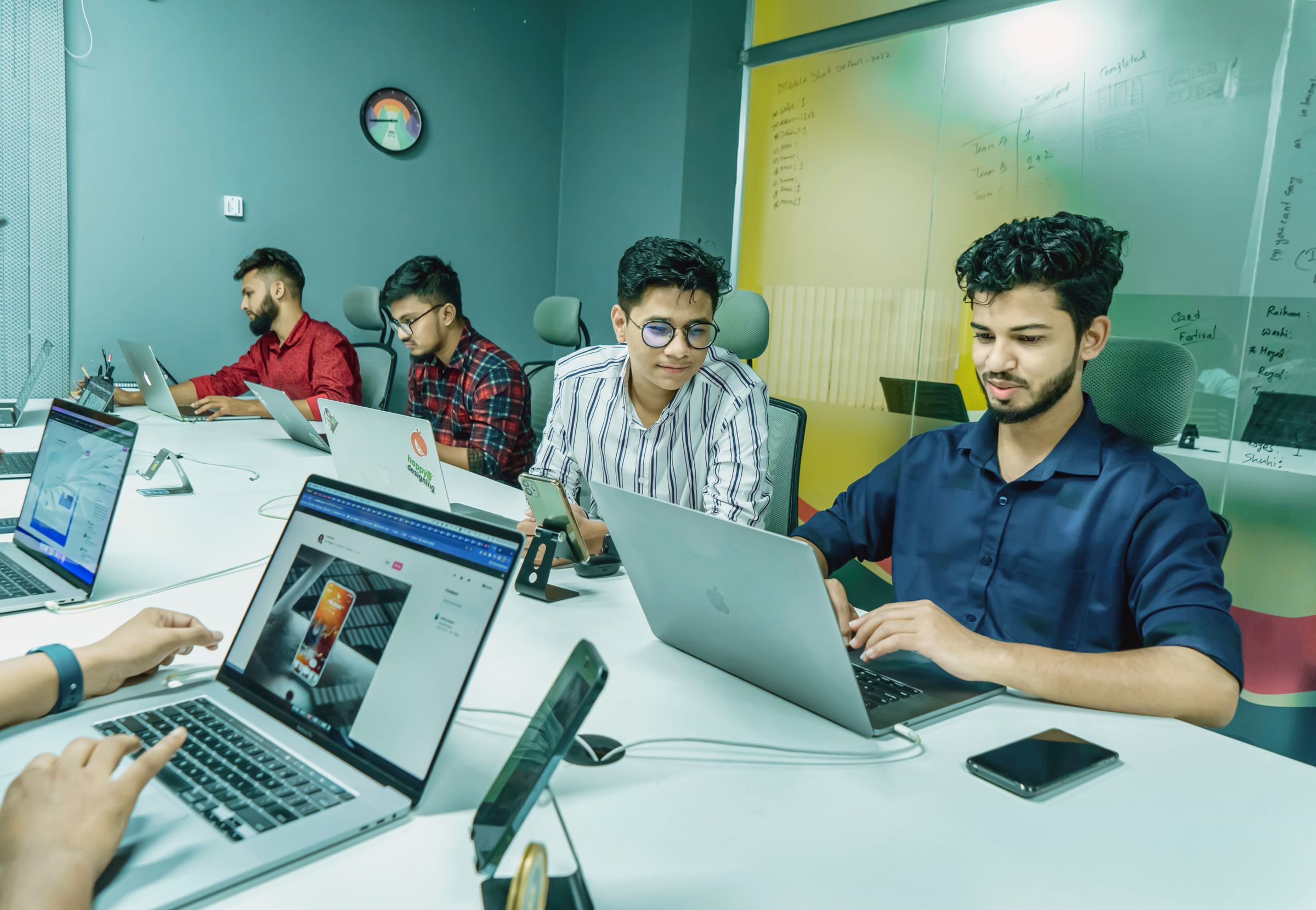 Revenue team working through connected workflows on their laptops
